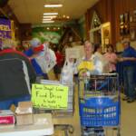 A shopper donates an entire bag of food to the drive 