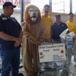 Chairperson Bob with some of the East Cocalico Lions with one of many carts full of food.