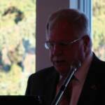 Lion Lou Danese,the Master of Ceremonies, calls the meeting to order.