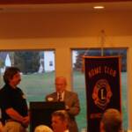 DG Jim then presents the Banner to Manor Ridge's Lion President John Leed